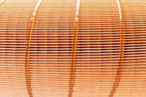 Texture of orange paper filter air purification systems close up spare part. Stock Photos