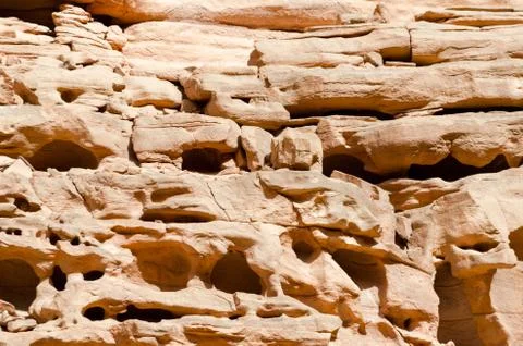 Texture of orange stone rock in a colored canyon close up Stock Photos