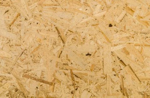 Texture of OSB board. Oriented Strand Boards. Panel of pressed sawdust Stock Photos