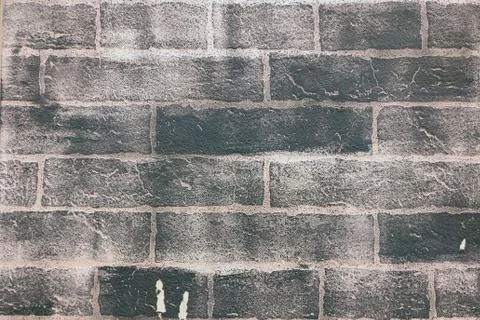 Texture of painted black brickwork, close-up background Stock Photos