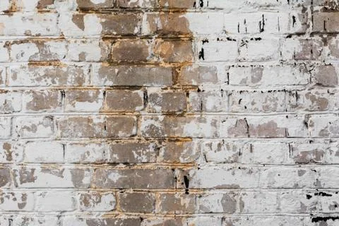 Texture painted old brick wall, damaged uneven brickwork, abstract background Stockfoto's
