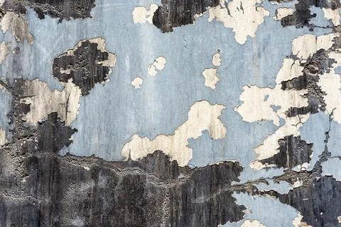 Texture of a painted old wall with cracks and stains of black paint on it Stock Photos