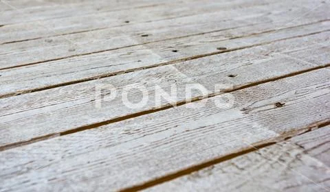 Texture of the painted shabby wooden flooring made of boards, grunge backgrou Stock Photos