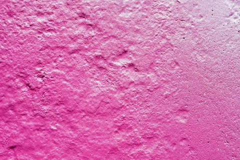 Texture of a painted wall. cement plate pink color background. wall with bump Stock Photos