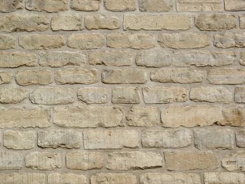 Texture of pale stone wall Stock Photos