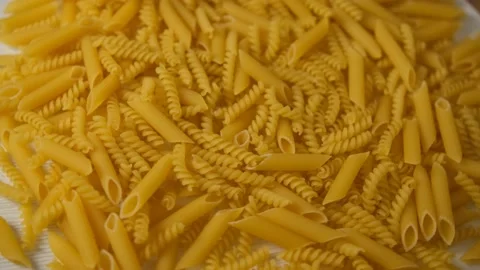 The texture of the pasta. Background. Swirl the pasta. Pasta conveyor. Flour pro Stock-Footage 147625552