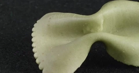 The texture of the pasta is close-up. Curly pasta macro. Video stock 166083394