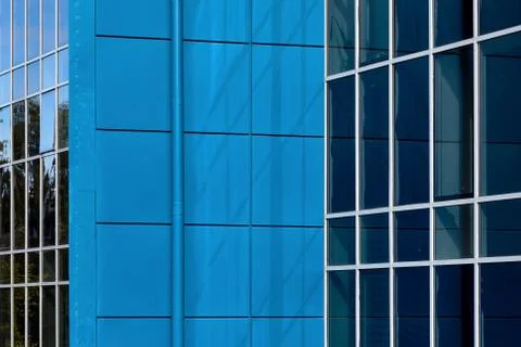 Texture pattern background of blue and green reflections in building mirrored Stock Photos