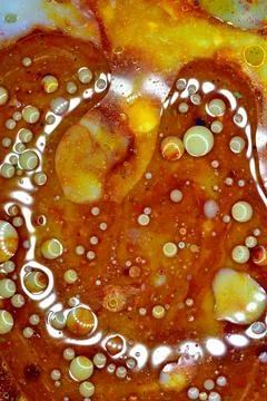 Texture pattern created by bubbles on a brown background. Stock Photos