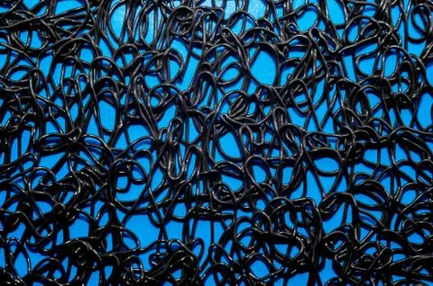Texture pattern of dark brown rubber on a blue background Stock Photos