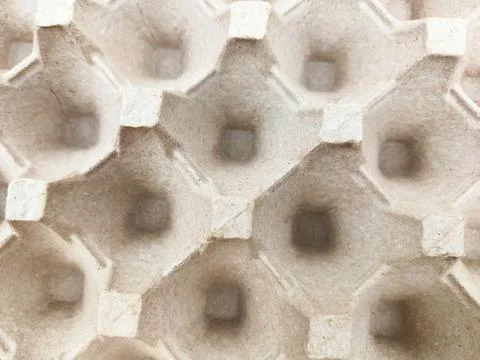 The texture pattern of the egg tray made of paper as a background. Stock Photos