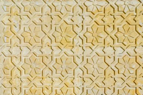 Texture with a pattern of flowers on the stone, close up. Background in arab  Foto stock