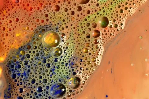 Texture pattern of a large number of small soap bubbles on a brown background. 写真素材
