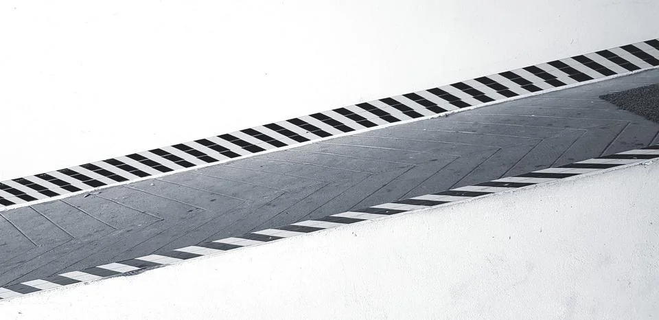 Texture of pattern line on slope pathway for sign warning people Stock Photos