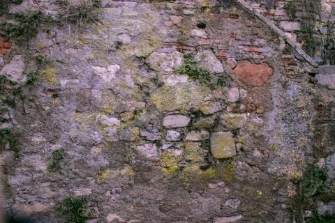 Texture from the pattern obtained from the folded stones in the masonry when Stock Photos