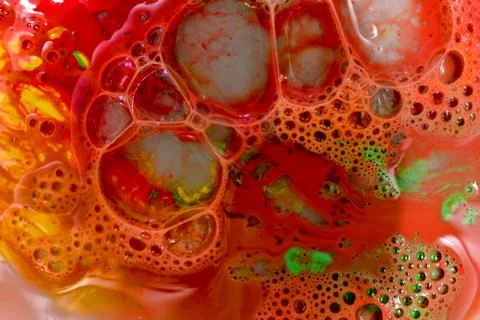 Texture pattern on a red background created from bubbles. Stock Photos