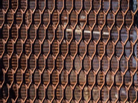 Texture pattern of rusty metal mesh Stock Photos