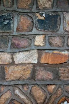 Texture,  pattern of traditional stone masonry walls of the house Stock Photos