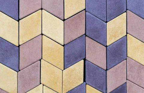 The texture of the paving slab wall of different colors for construction. Fac Stock Photos