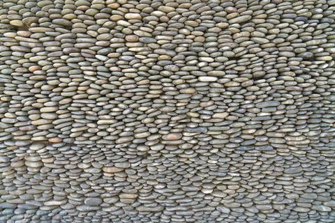 The texture of the pebbles in close-up as a background Photos