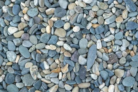 The texture of the pebbles in close-up as a background Stock Photos