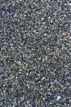 The texture of the pebbles in close-up as a background 스톡 사진