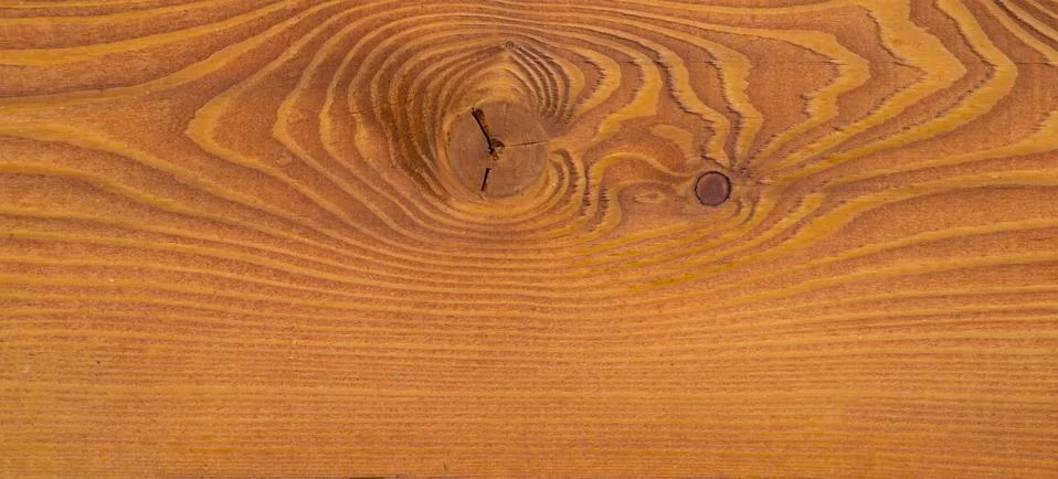 The texture of a pine board with an interesting pattern. Stock Photos