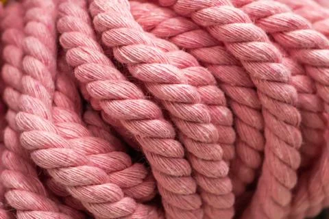 Texture of pink fluffy woolen threads for knitting. Stock Photos