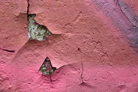 The texture of the pink paint on the old wall. Stock Photos