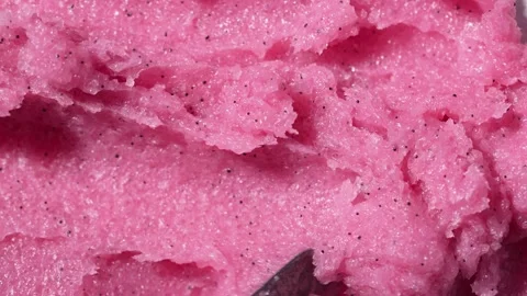 Texture of pink raspberry scrub. Fruit exfoliation scrubber for body Stock Footage 310085772