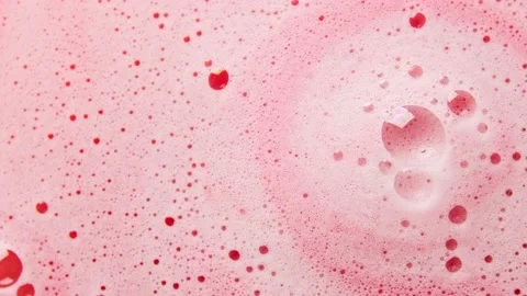 Texture of pink soap foam with bubbles rotates abstract background. Stock Footage 147385118