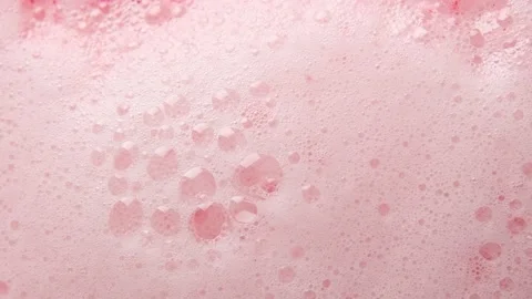 Texture of pink soap foam seethes boil with bubbles abstract background. Stock Footage 147385631