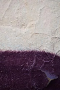 The texture of the plaster wall with the color of beige and cherry color. Stock Photos