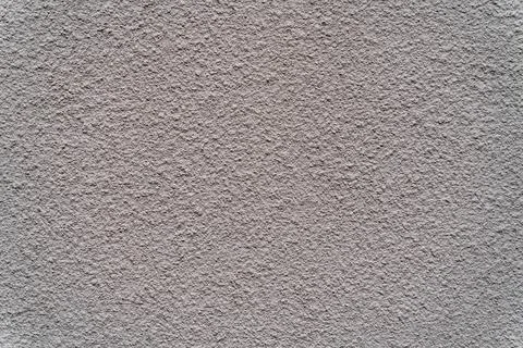 Texture of plaster on the wall. Gray background putty wall. Stock Photos