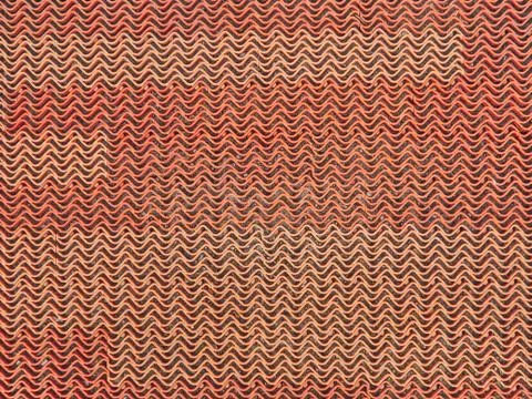 The texture of the plastic grille is red. Wave pattern Foto stock