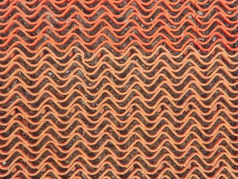 The texture of the plastic grille is red. Wave pattern Foto stock