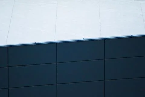 The texture of the plastic panels on the building. Stock Photos