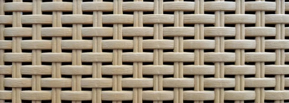 Texture. Plastic rattan with symmetrical pattern Stockfoto's