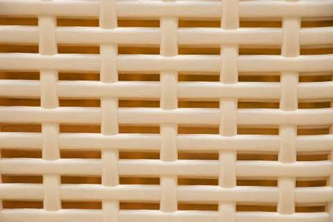 The texture of a plastic wicker basket closeup. Stock Photos