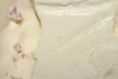 Texture of processed cheese with ham top view.Background of melted cheese. Stock Photos