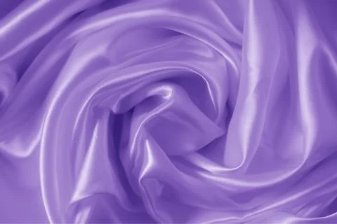 The texture of the proton purple cloth with waves and shrugs. Shiny fabric. Stock Photos
