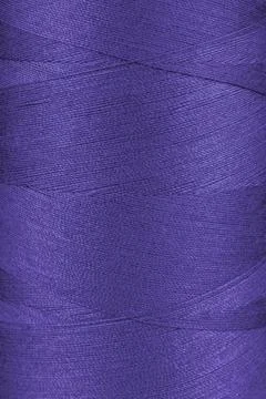 Texture of purple color threads in spool close up, macro Stock Photos
