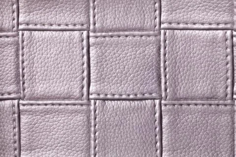 Texture of purple leather background with square pattern and stitch, macro. Foto stock