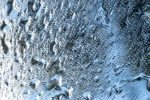 The texture of the raindrop is reflected on the mirror surface 3 Stock-Fotos