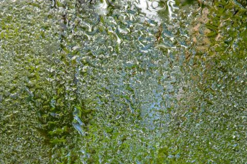 The texture of the raindrop is reflected on the mirror surface 4 Stockfoto's