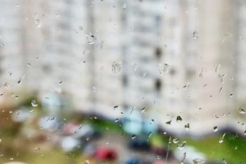 The texture of raindrops on the window in the daytime. Close-up of raindrops on Stock Photos