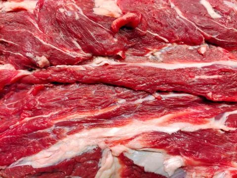 Texture of raw beef meat with streaks of lard on the full frame close-up Stock Photos