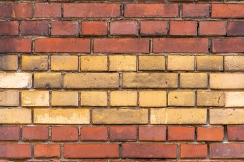 Texture of red and beige old clinker facade close up Stock Photos
