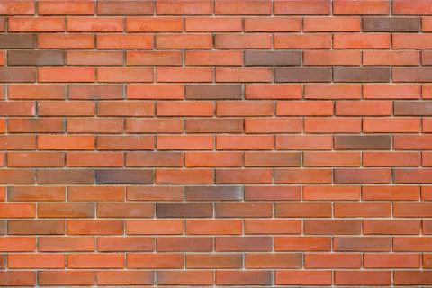 Texture of a red and brown brick wall background 스톡 사진