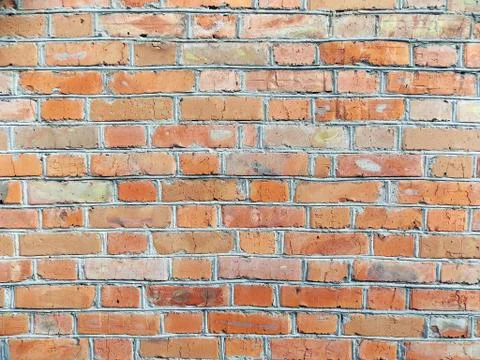 Texture red brick wall with uneven masonry Stock Photos